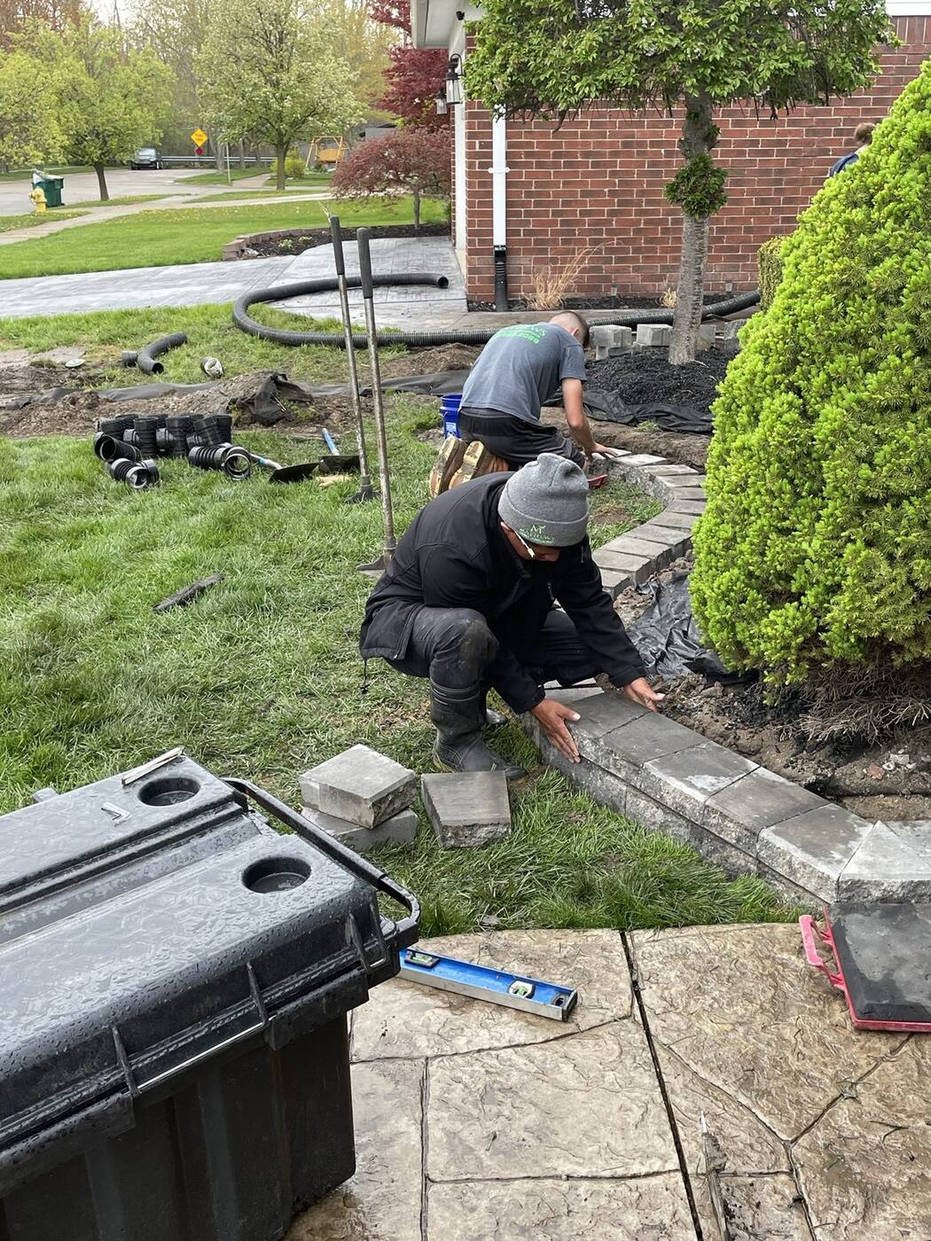 Our crew setting garden wall caps
