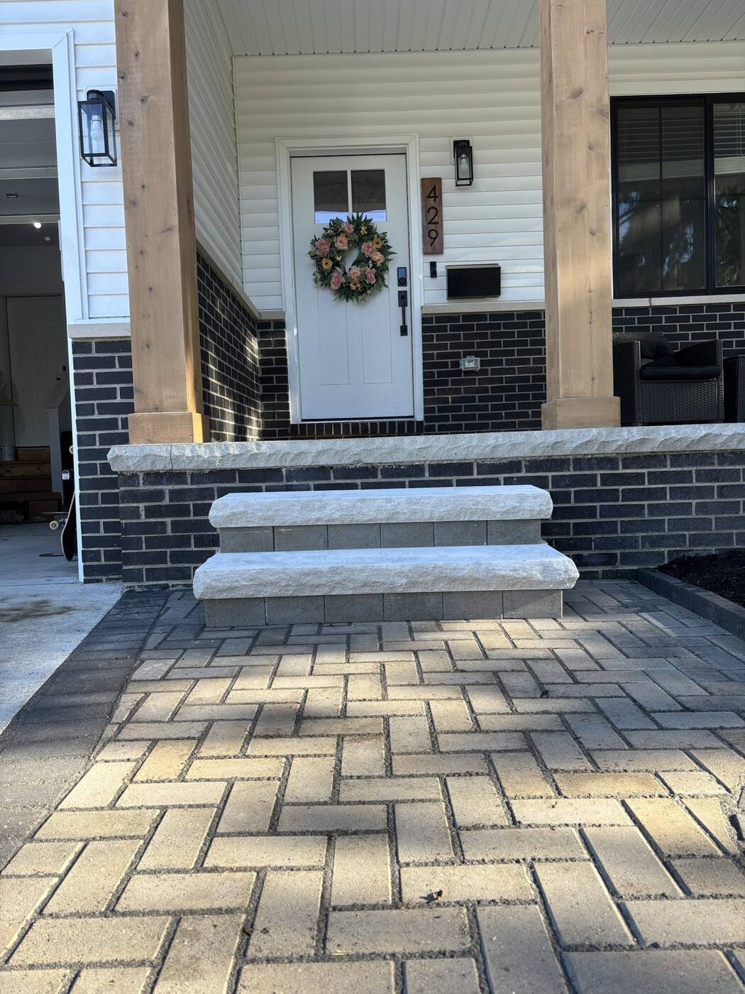 Natural stone steps and herringbone paver walk