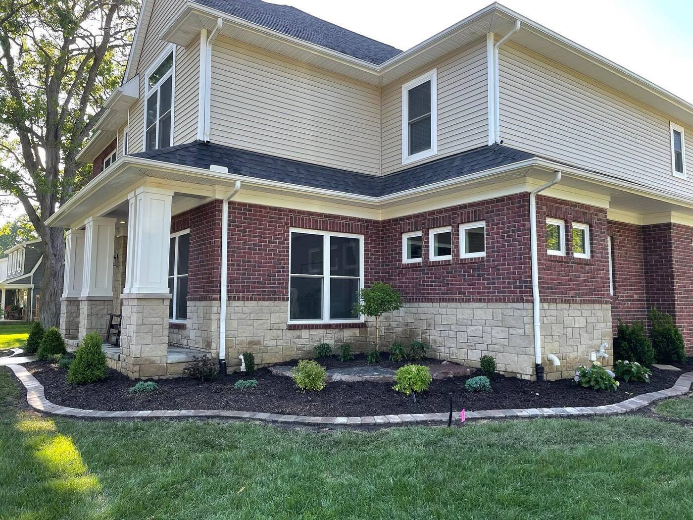 New build front beds with brick paver edging